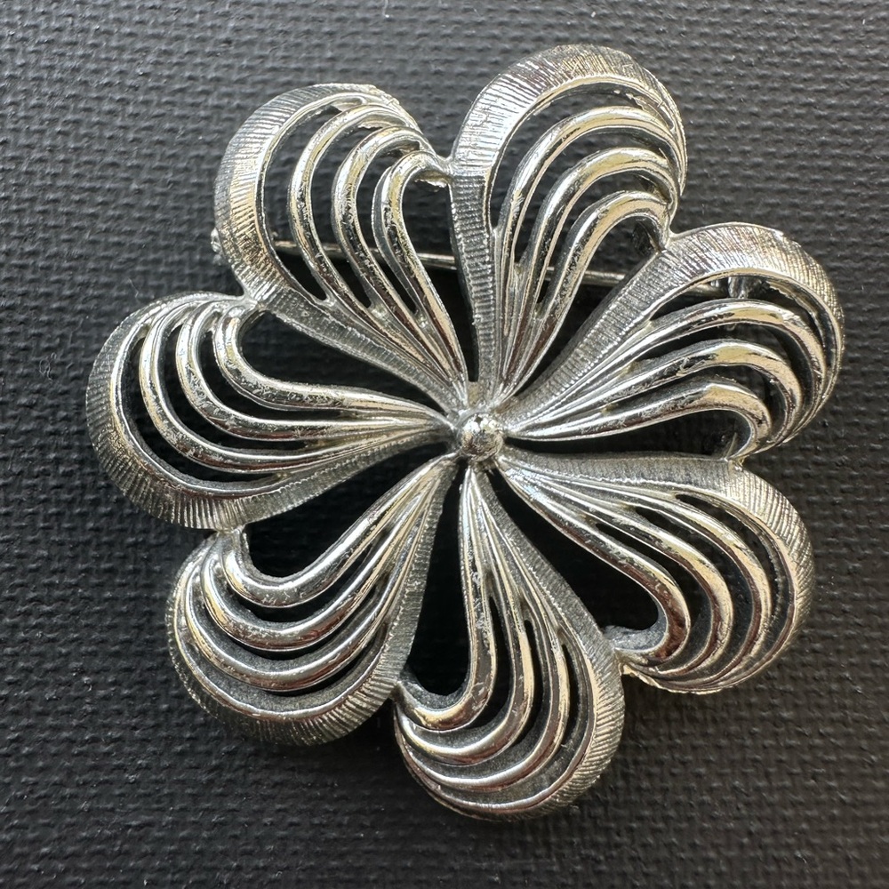 Vintage silver-tone floral & swirl-design brooch.